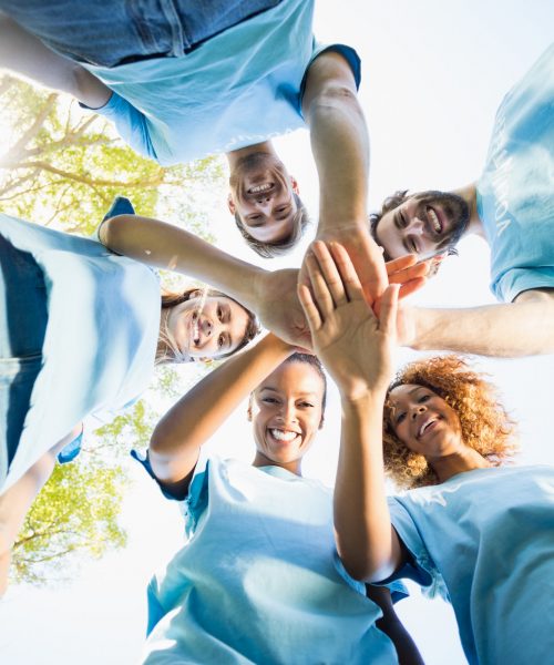 portrait-of-volunteer-group-forming-huddles.jpg